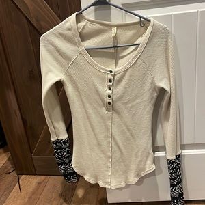 Free people cream with black and white detail on sleeves good condition
